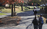 students walking outside on the campus in autumn